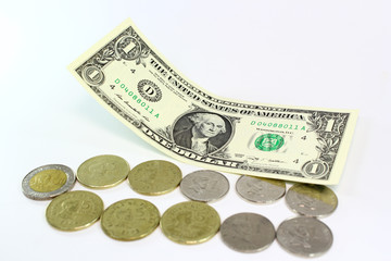 Peso coins dollar bill