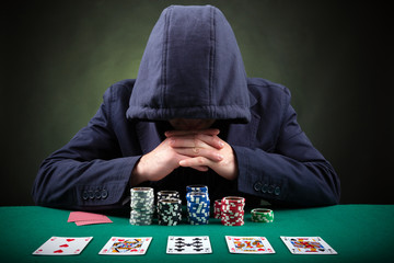 Poker player on black background