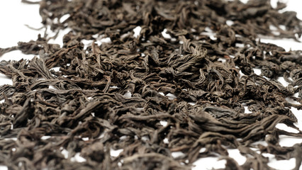 The leaves of black tea on a white background