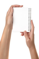 Hands holding notebook isolated on white