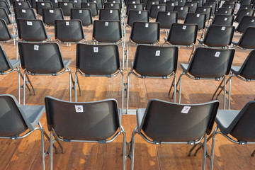 Empty numbered chairs lined-up