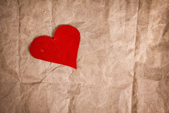paper heart on crumpled paper