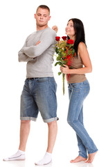 Attractive young couple gift rose in hand isolated