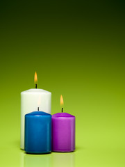 burning colorful wax candles
