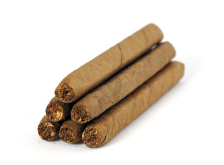 Heap of cigars isolated on white