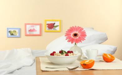 light breakfast on the nightstand next to the bed