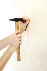 man hands with nail and hammer
