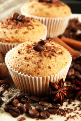 tasty muffin cakes with chocolate, spices and coffee seeds,