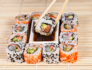 Different types of Sushi in a plate isolated on white background