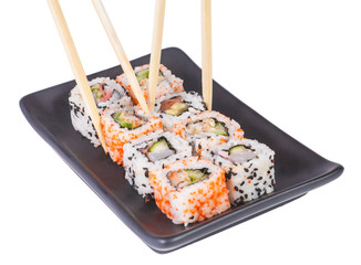 Different types of Sushi in a plate isolated on white background