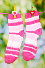 Pair of striped socks hanging to dry
