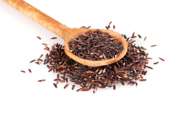 black rice  in wooden  spoon isolated on white background