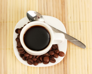 Cup of coffee on brown background