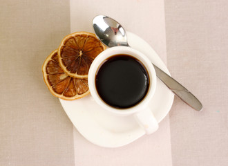 Cup of coffee on brown background