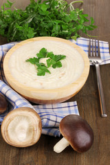 Mashed potatoes in wooden bowl with ingredients