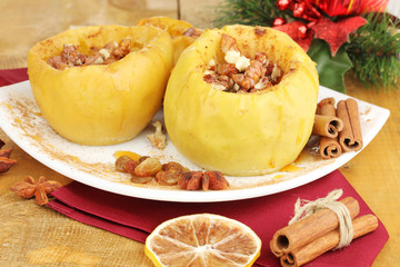 Baked apples on plate close up