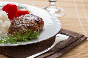Meatballs with rice, dill and tomatoes served on table