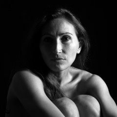 Beautiful middle age woman close up portrait. Black and white.