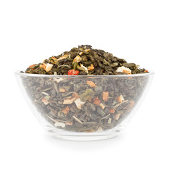 Glass bowl of exotic green tea with slices of dried fruit