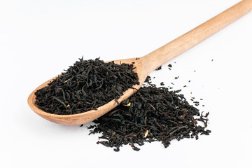 Black tea in a wooden spoon