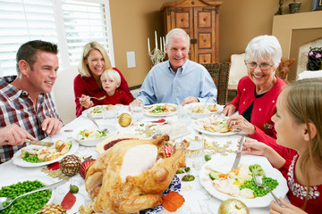 Multi Generation Family Celebrating With Christmas Meal