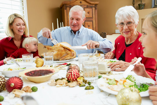 Multi Generation Family Celebrating With Christmas Meal