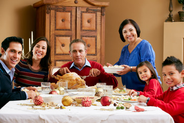 Multi Generation Family Celebrating With Christmas Meal