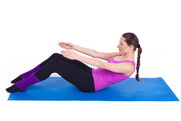 healthy young woman exercising in gym, over white background