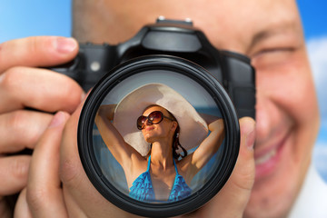 Photographer capturing portrait of bikini girl