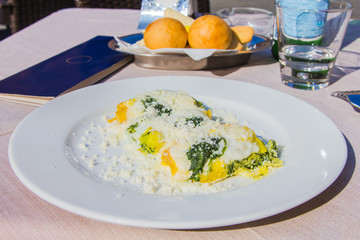 Crespelle with parmesan from Bologna, Italy