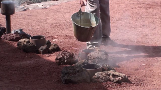 Geyser of steam in Timanfaya National Park Lanzarote at Canary I