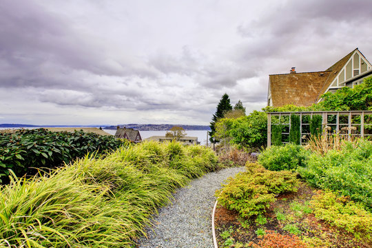 Dark and cloudy Tacoma winter with frot yard landscape.