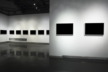 frames on white wall in art museum
