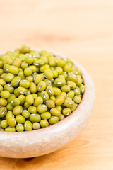Green mung beans in bowl on the table