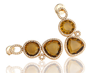 Luxury topaz earring surrounded by shiny diamond