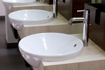 Three of wash basin in the rest room