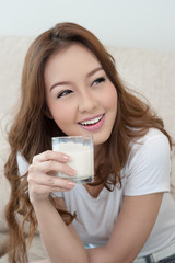Asian Young Woman Drinking Milk