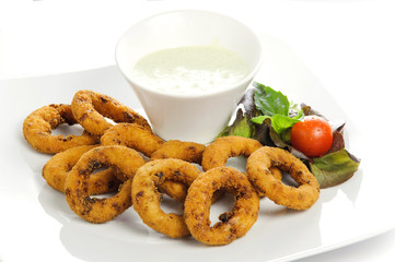 Squid rings with vegetables and salad