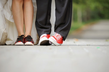 Newlyweds' Legs in Sneakers