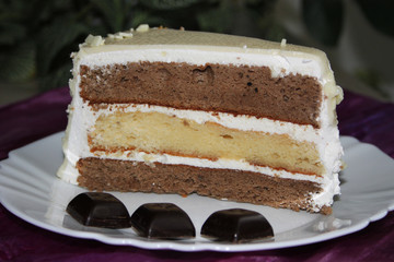 Three - layer cake and black chocolate candies for decoration