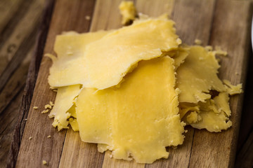 Sliced cheese on board