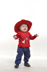 Little boy in red hat crying