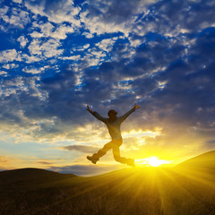 Fototapeta premium man lumping on a sunset background