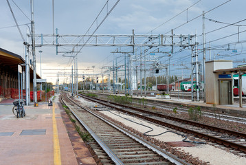 the last train on railroad station in evening