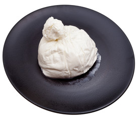 fresh italian cheese burrata on black ceramic plate