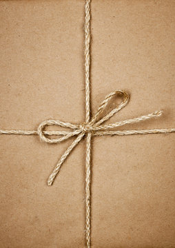 Package in brown paper tied with string