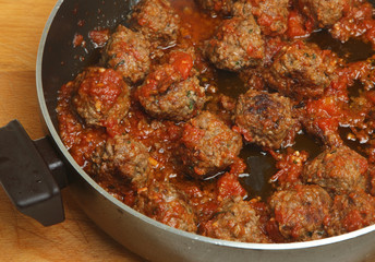Cooking Meatballs in Spicy Tomato Sauce