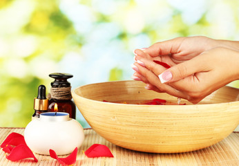 spa treatments for female hands,  on green background