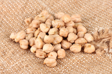 White chickpeas on sackcloth background