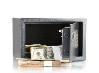 Naklejka premium Money in open safe isolated on white